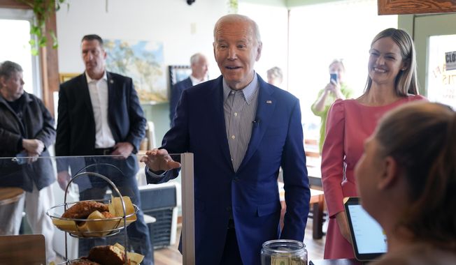 President Joe Biden arrives at Zummo&#x27;s Cafe, Wednesday morning, April 17, 2024, in Scranton, Pa., with Scranton Mayor Paige Cognetti, right. (AP Photo/Alex Brandon)