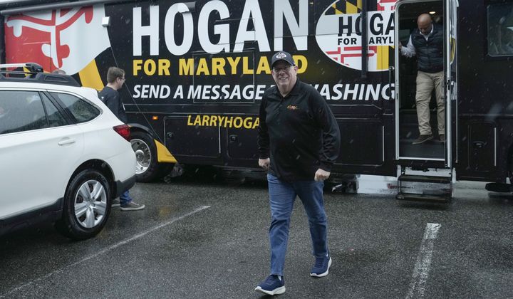 Former Maryland Gov. Larry Hogan steps off of his campaign bus for a stop at DePaola&#x27;s Bagel and Brunch in Stevensville, Md., Friday, April 12, 2024, as he campaigns for the U.S. Senate. (AP Photo/Susan Walsh)