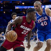 Miami Heat&#x27;s Jimmy Butler, left, drives to the basket against Philadelphia 76ers&#x27; Nicolas Batum during the first half of an NBA basketball play-in tournament game Wednesday, April 17, 2024, in Philadelphia. (AP Photo/Chris Szagola)