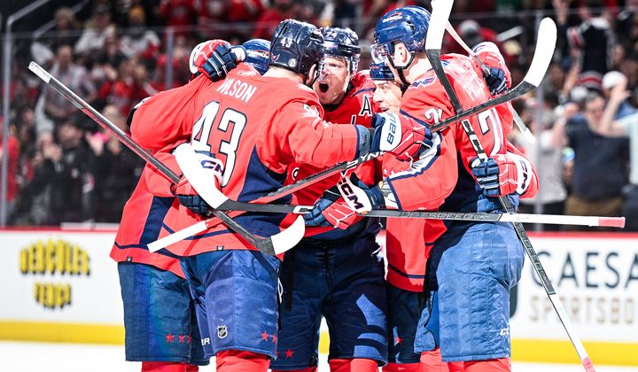 Washington Capitals defenseman John Carlson (74) celebrates with teammates after netting his 10th goal of the season against the Boston Bruins at Capital One Arena, Washington, D.C., April 15, 2024. (Photo by Brian Murphy for the Washington Times)
