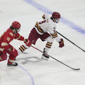 Boston College forward Ryan Leonard skates past Denver forward Miko Matikka (10) during the first period in the championship game of the Frozen Four NCAA college hockey tournament Saturday, April 13, 2024, in St. Paul, Minn. (AP Photo/Abbie Parr)