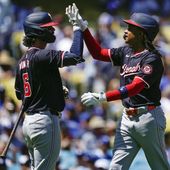 Washington Nationals&#x27; CJ Abrams, right celebrates with Jesse Winker after hitting a solo home run during the first inning of a baseball game against the Los Angeles Dodgers, Wednesday, April 17, 2024, in Los Angeles. (AP Photo/Ryan Sun)