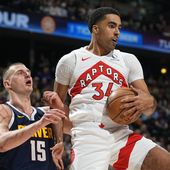 Toronto Raptors center Jontay Porter, right, pulls in a rebound as Denver Nuggets center Nikola Jokic, left, defends in the first half of an NBA basketball game Monday, March 11, 2024, in Denver. The NBA banned Toronto two-way player Jontay Porter on Wednesday, April 17, 2024, after a league probe found he disclosed confidential information to sports bettors and bet on games.(AP Photo/David Zalubowski, File)