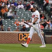 Baltimore Orioles&#x27; Jackson Holliday walks to the dugout after striking out against the Minnesota Twins during the sixth inning of a baseball game, Wednesday, April 17, 2024, in Baltimore. (AP Photo/Jess Rapfogel)