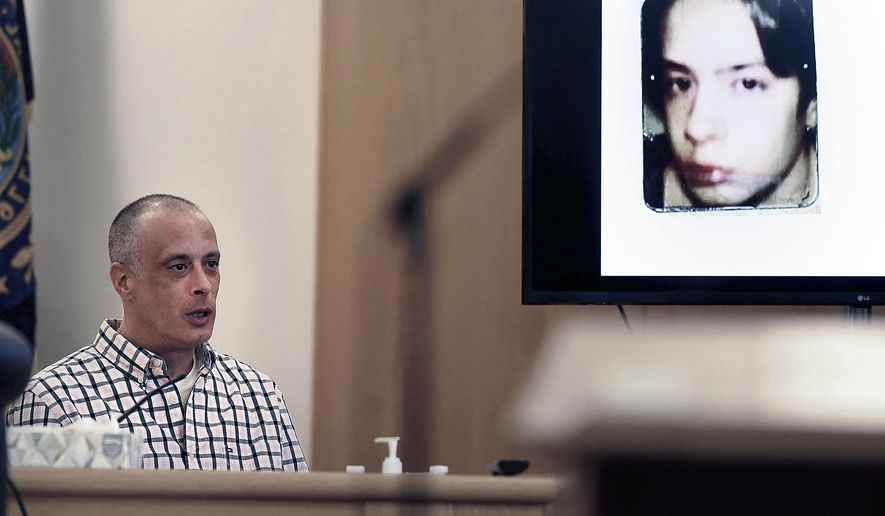 Youth Development Center plaintiff David Meehan testifies as his intake photo, when he was 14, is displayed during his civil trial at Rockingham County Superior Court in Brentwood, N.H. on Wednesday, April 17, 2024. (David Lane/Union Leader via AP, Pool)