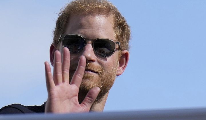Britain&#x27;s Prince Harry, the Duke of Sussex, waves during the Formula One U.S. Grand Prix auto race at Circuit of the Americas, on Oct. 22, 2023, in Austin, Texas. Prince Harry, the son of King Charles III and fifth in line to the British throne, has formally confirmed his is now a U.S. resident. Four years after Harry and his American wife, Meghan, decamped to a villa on the Southern California coast, a travel company he controls filed paperwork informing British authorities that he has moved and is now “usually resident” in the United States. (AP Photo/Nick Didlick, File)