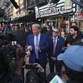 Former president Donald Trump, talks to members of the media while visiting a bodega, Tuesday, April 16, 2024, who&#x27;s owner was attacked last year in New York. Fresh from a Manhattan courtroom, Donald Trump visited a New York bodega where a man was stabbed to death, a stark pivot for the former president as he juggles being a criminal defendant and the Republican challenger intent on blaming President Joe Biden for crime. Alba&#x27;s attorney, Rich Cardinale, second from left, and Fransisco Marte, president of the Bodega Association, looked on. (AP Photo/Yuki Iwamura)