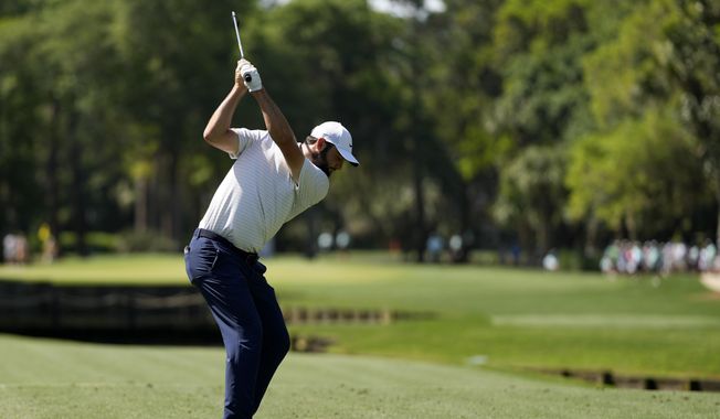 Scottie Scheffler hits his tee shot on the fourth hole during the first round of the RBC Heritage golf tournament, Thursday, April 18, 2024, in Hilton Head, S.C. (AP Photo/Chris Carlson)