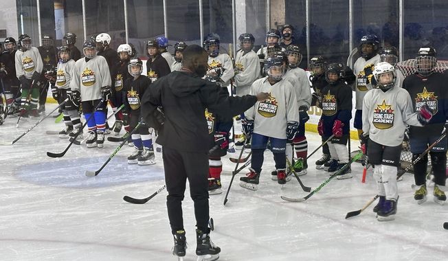 Duanté Abercrombie speaks to players as an instructor at the Washington Capitals&#x27; inaugural Rising Stars Academy in Arlington, Va., Aug. 20, 2023. Tennessee State has taken its biggest step yet toward becoming the first historically Black college and university to introduce ice hockey by hiring Abercrombie as coach. (AP Photo/Stephen Whyno, File)