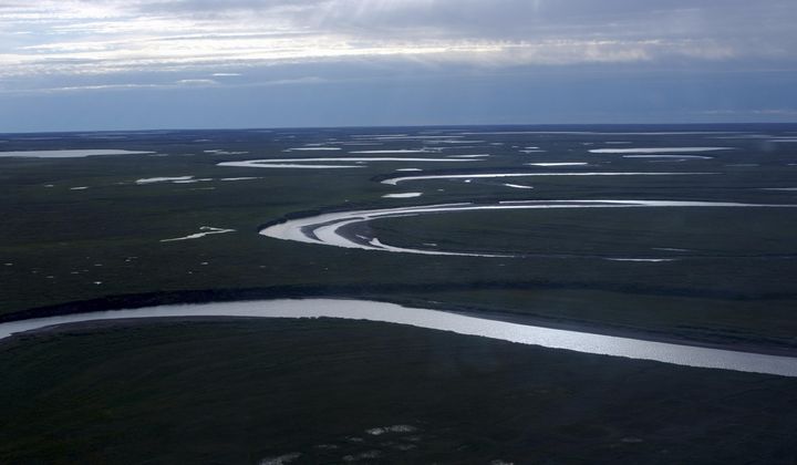 This July 8, 2004, photo provided by the United States Geological Survey shows Fish Creek through the National Petroleum Reserve-Alaska, managed by the Bureau of Land Management on Alaska&#x27;s North Slope. (David W. Houseknecht/United States Geological Survey via AP)