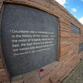 In this photo taken with fisheye lens, a plaque with a quote from President Bill Clinton is displayed on the wall of healing at the Columbine Memorial, April 17, 2024, in Littleton, Colo. The 12 students and a teacher killed in the Columbine High School shooting will be remembered Friday, April 19, 2024, in a vigil on the eve of the 25th anniversary of the tragedy. (AP Photo/David Zalubowski, File)