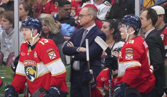 Florida Panthers coach Paul Maurice watches during the second period of the team&#x27;s NHL hockey game against the New York Islanders Thursday, March 28, 2024, in Sunrise, Fla. (AP Photo/Jim Rassol)