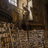 Photographs of Ukrainian soldiers killed during the Russian Ukrainian war are displayed in the Saints Peter and Paul church in Lviv, Ukraine, April 16, 2024. (AP Photo/Francisco Seco)