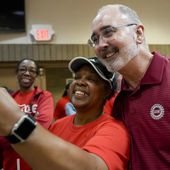 Volkswagen automobile plant employee LaShawn Hawthorne, center left, takes picture with UAW president Shawn Fain after workers voted to join the union Friday, April 19, 2024, in Chattanooga, Tenn. (AP Photo/George Walker IV) ** FILE **