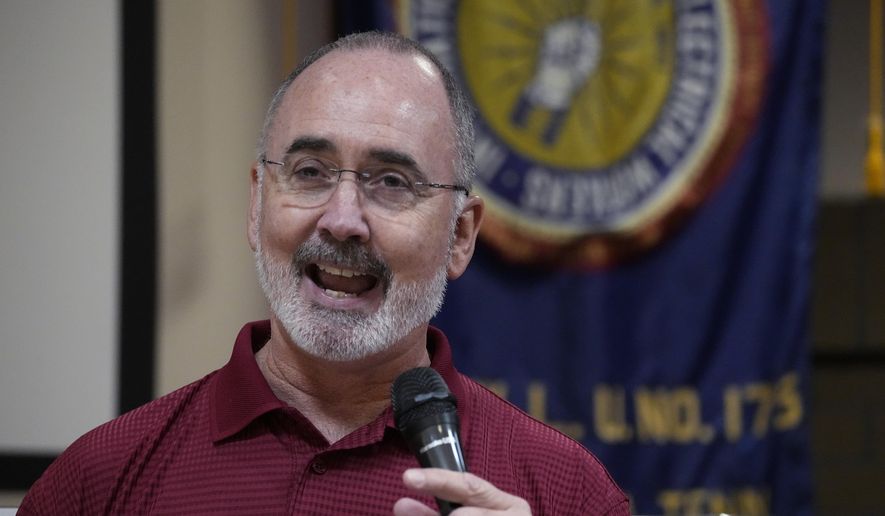United Auto Workers President Shawn Fain speaks to Volkswagen auto workers Friday, April 19, 2024, in Chattanooga, Tenn., after workers at a VW factory voted to join the UAW. (AP Photo/George Walker IV)