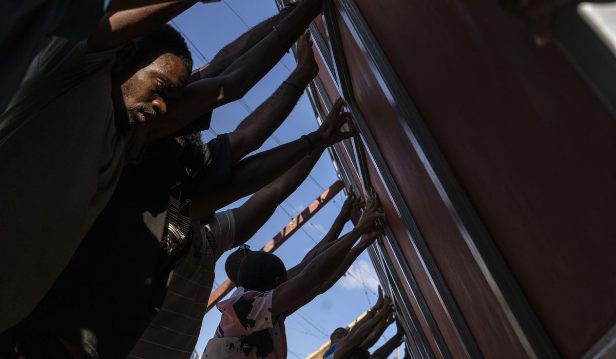 NextImg:Haitians scramble to survive, seeking food, water and safety as gang violence chokes the capital