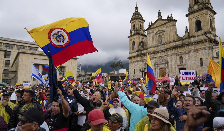 Anti-government demonstrators rally to protest economic and social reforms pushed by the government of President Gustavo Petro and his proposal to convene a constituent assembly at the Bolivar Square in Bogota, Colombia, Sunday, April 21, 2024. (AP Photo/Fernando Vergara)