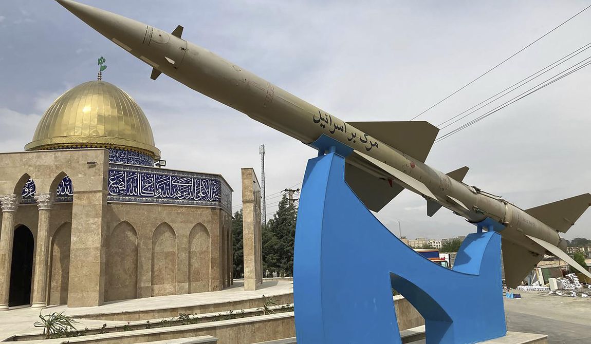 A missile is on display with a sign on it reading in Farsi: &quot;Death to Israel&quot; in front of a mosque in the shape of Dome of the Rock of Jerusalem at an entrance of the Quds town west of the capital Tehran, Iran, Sunday, April 21, 2024. Iran&#x27;s supreme leader Ayatollah Khamenei on Sunday dismissed any discussion of whether Tehran&#x27;s unprecedented drone-and-missile attack on Israel hit anything there, a tacit acknowledgment that despite launching a massive assault, few projectiles actually made through to their targets. (AP Photo/Vahid Salemi)