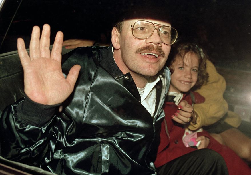 Terry Anderson, who was the longest-held American hostage in Lebanon, grins with his 6-year-old daughter Sulome, Dec. 4, 1991, as they leave the U.S. Ambassador's residence in Damascus, Syria, following Anderson's release. Anderson, the globe-trotting Associated Press correspondent who became one of America’s longest-held hostages after he was snatched from a street in war-torn Lebanon in 1985 and held for nearly seven years, died Sunday, April 21, 2024. He was 76. (AP Photo/Santiago Lyon, File)
