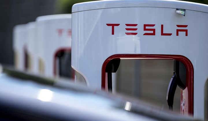 A Tesla charging station is seen, Sept. 28, 2023, in Woodstock, Ga. (AP Photo/Mike Stewart, File)