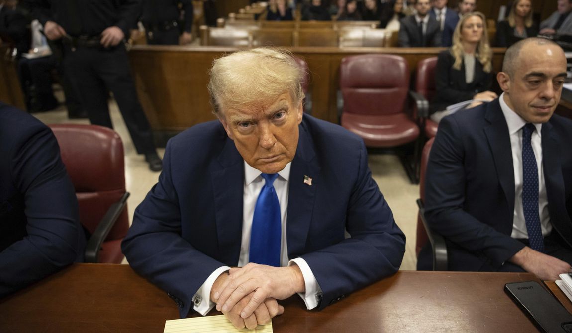 Former president Donald Trump, center, awaits the start of proceedings at Manhattan criminal court, Monday, April 22, 2024, in New York. Opening statements in Donald Trump&#x27;s historic hush money trial are set to begin. Trump is accused of falsifying internal business records as part of an alleged scheme to bury stories he thought might hurt his presidential campaign in 2016. (AP Photo/Yuki Iwamura, Pool)