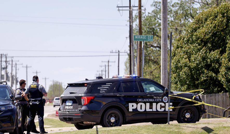 Police investigate after people were found dead in a home in Oklahoma City on Monday, April 22, 2024. Oklahoma City police called to a home on the city&#x27;s southwest side Monday discovered the bodies of five people, including at least two children, authorities said. (Nathan J. Fish/The Oklahoman via AP)