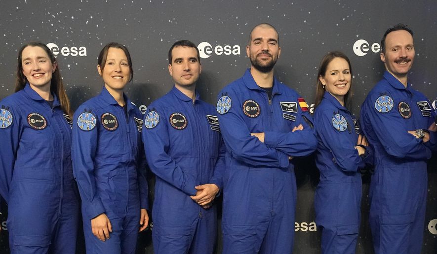 From left, Rosemary Cooga of Britain, Sophie Adenot of France, Raphael Liegeois of Belgium, Pablo Alvarez Fernandez of Spain, Katherine Bennell-Pegg of Australia and Marco Sieber of Switzerland, pose for a family photo at the graduation ceremony of astronaut candidates of the Class of 2022 at the European Astronaut Centre in Cologne, Germany, Monday, April 22, 2024. The new ESA astronauts took up duty at the European Astronaut Centre one year ago to be trained to the highest level of standards as specified by the International Space Station partners. Also concluding a year of astronaut basic training is Australian astronaut candidate Katherine Bennell-Pegg, who has trained alongside ESA&#x27;s candidates. (AP Photo/Martin Meissner)