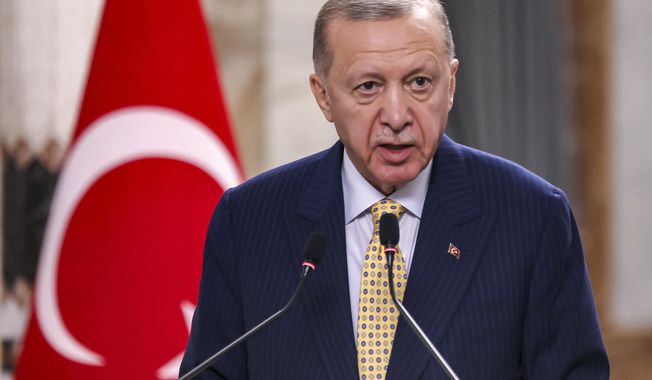 Turkish President Recep Tayyip Erdogan speaks during a joint statement to the media in Baghdad, Iraq, Monday, April 22, 2024. Erdogan arrived in Iraq on Monday for his first official visit in more than a decade. (Ahmad Al-Rubaye /Pool Photo via AP)