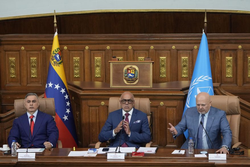 Karim Khan, chief prosecutor of the International Criminal Court, right, speaks next to National Assembly President Jorge Rodriguez, center, and Venezuelan General Attorney Tarek William Saab at the National Assembly in Caracas, Venezuela, Monday, April 22, 2024. (AP Photo/Ariana Cubillos)