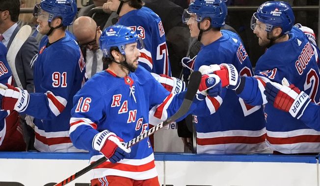 New York Rangers&#x27; Vincent Trocheck (16) celebrates with teammates after scoring a goal during the first period in Game 2 of an NHL hockey Stanley Cup first-round playoff series against the Washington Capitals, Tuesday, April 23, 2024, in New York. (AP Photo/Frank Franklin II)