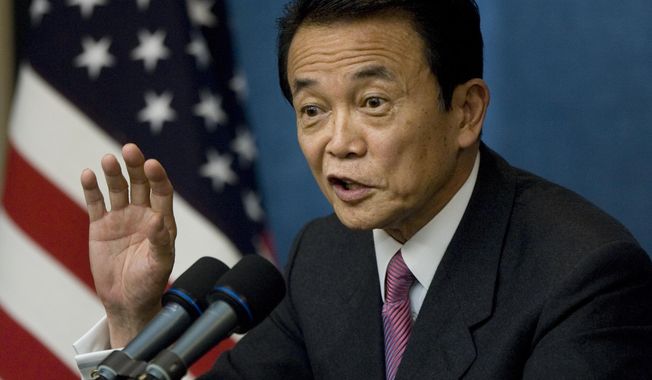 FILE - Then Prime Minister Taro Aso of Japan speaks with reporters during a news conference at the end of the financial summit in Washington, Nov. 15, 2008. Former President Donald Trump is meeting with another foreign leader while he’s in New York for his criminal hush money trial. The presumptive GOP nominee will host former Japanese prime minister Taro Aso at Trump Tower Tuesday, according to two people familiar with the plans. (AP Photo/J. Scott Applewhite, File)