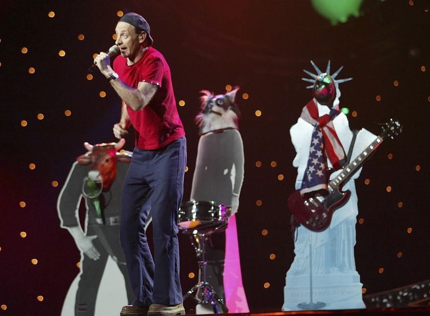 FILE - Austria's entry in the Eurovision Song Contest 2003 Alf Poier sings 'Man is a Measure of all Things' during the final in Riga, Latvia, May 24, 2003. The 68th Eurovision Song Contest is taking place in May in Malmö, Sweden. It will see acts from 37 countries vie for the continent’s pop crown. Founded in 1956, Eurovision is a feelgood extravaganza that strives to banish international strife and division. It’s known for songs that range from anthemic to extremely silly, often with elaborate costumes and spectacular staging. (AP Photo/Alastair Grant, File)