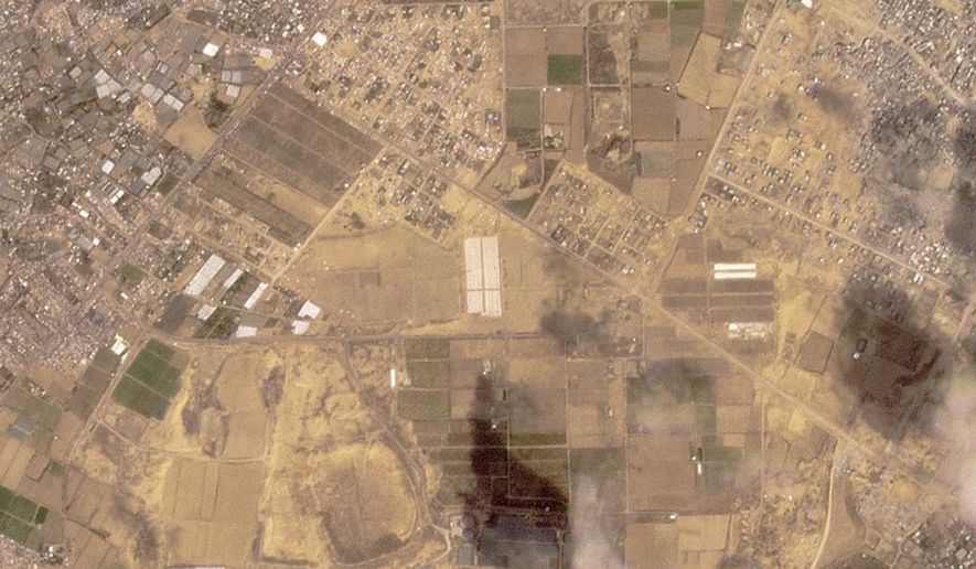 This satellite image from Planet Labs PBC shows tents being constructed near Khan Younis in the Gaza Strip on Sunday, April 21, 2024. Satellite photos analyzed Tuesday, April 23 by The Associated Press appear to show a new compound of tents being built near Khan Younis in the Gaza Strip as the Israeli military continues to signal it plans an offensive targeting the city of Rafah. (Planet Labs PBC via AP)