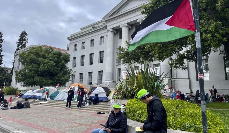 Pro-Palestinian protesters gather in front of Sproul Hall on the campus of the University of California, Berkeley in Berkeley, Calif., Tuesday, April 23, 2024. The Israel-Hamas war protests creating friction at universities across the United States escalated Tuesday as some colleges encouraged students to attend classes remotely and dozens faced charges after setting up tents on campuses and ignoring official requests to leave. (AP Photo/Haven Daley)