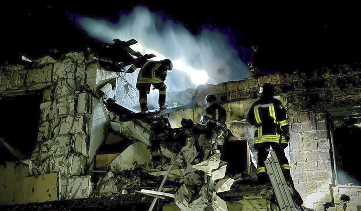 In this photo provided by the Mayor of Odesa Hennadii Trukhanov in Telegram, firefighters work on the site of a burning building after a Russian drone attack in Odesa, Ukraine, Tuesday, April 23, 2024. (Mayor of Odesa Hennadii Trukhanov via AP)