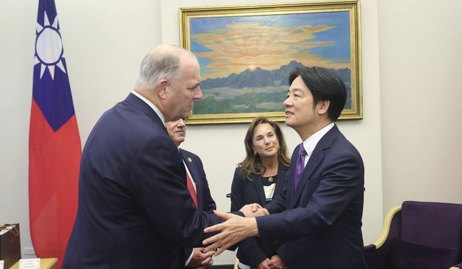 In this photo released by the Taiwan Presidential Office, U.S. Democratic Congressman Dan Kildee, left, meets with Taiwan President-elect and Vice President Lai Ching-te in Taipei, Taiwan on Tuesday, April 23, 2024. Kildee and Lisa McClain, secretary-general of the Republican Caucus of the U.S. House of Representatives jointly led a cross-party group of lawmakers to visit Taiwan from April 23 to 25 . Members also include Mark Alford, a member of the House Armed Services Committee. (Taiwan Presidential Office via AP)