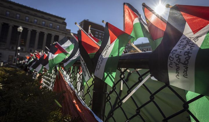 A row of Palestinian flags are seen on the fence at the pro-Palestinians demonstration encampment at Columbia University in New York on Wednesday April 24, 2024. (AP Photo/Stefan Jeremiah)