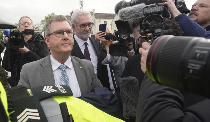 Former DUP leader Sir Jeffrey Donaldson arrives at Newry Magistrates&#x27; Court, where he is charged with several historical sexual offences, in Newry, Northern Ireland, Wednesday April 24, 2024. Sir Jeffrey resigned as DUP leader and was suspended from the party following the charges. (Niall Carson/PA via AP)