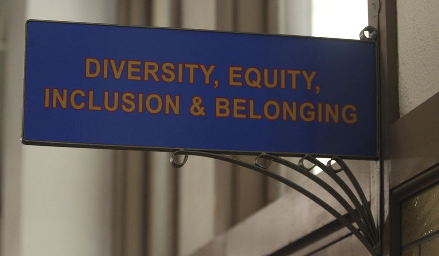 The sign above the door to the Office of Diversity, Equity, Inclusion and Belonging inside the main administration building on the main University of Kansas campus is seen on Friday, April 12, 2024, in Lawrence, Kan. A conservative quest to limit diversity, equity and inclusion initiatives is gaining momentum in state capitals and college governing boards, with officials in about one-third of the states now taking some sort of action against it. (AP Photo/John Hanna, File)