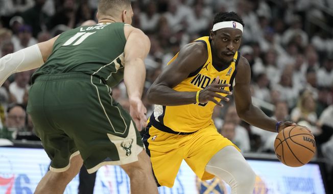 Indiana Pacers&#x27; Pascal Siakam tries to get past Milwaukee Bucks&#x27; Brook Lopez during the second half of Game 2 of the first round NBA playoff basketball series Tuesday, April 23, 2024, in Milwaukee.The Pacers won 125-108 to tie the series 1-1. (AP Photo/Morry Gash)