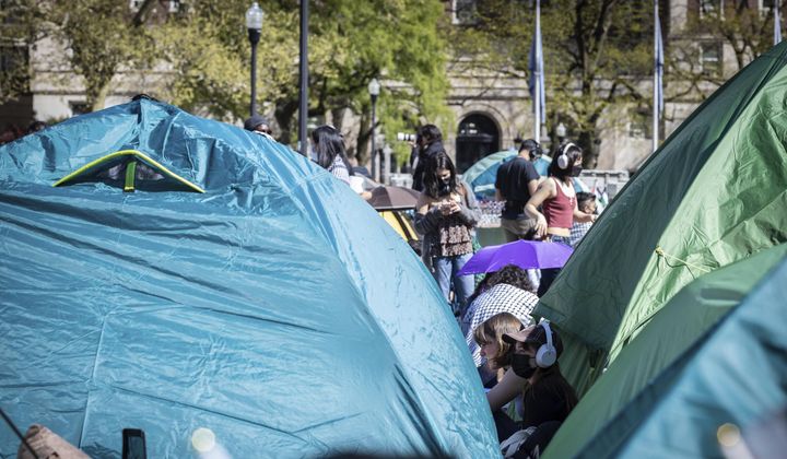 A student protester sits among the tents erected at the pro-Palestinian demonstration encampment at Columbia University in New York, Monday April 22, 2024. (AP Photo/Stefan Jeremiah)