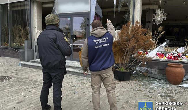 In this photo provided by Kharkiv Regional Prosecutor&#x27;s Office, war crime prosecutors inspect the scene after Russia&#x27;s attack in Kharkiv, Ukraine, Wednesday, April 24, 2024. (Kharkiv Regional Prosecutor&#x27;s Office/ via AP)