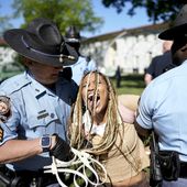 Georgia State Patrol officers detain a demonstrator on the campus of Emory University during a pro-Palestinian demonstration, Thursday, April 25, 2024, in Atlanta. (AP Photo/Mike Stewart)