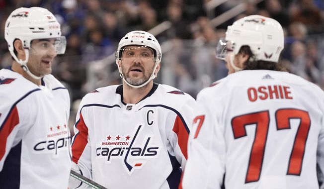 Washington Capitals&#x27; Alex Ovechkin, center, talks to T.J. Oshie, right, and Max Pacioretty during the third period in Game 2 of the team&#x27;s NHL hockey Stanley Cup first-round playoff series against the New York Rangers, Tuesday, April 23, 2024, in New York. (AP Photo/Frank Franklin II) **FiLE**