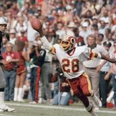 Washington Redskins Darrell Green (28) is shown in action during an NFL football game against the Los Angeles Raiders in Washington, Oct. 2, 1983. At left is Raiders quarterback Jim Plunkett. The Washington Commanders are retiring Hall of Fame cornerback Darrell Green&#x27;s No. 28 next season, the latest step in the organization&#x27;s efforts to honor players of the past since new ownership took over last summer. The team announced Thursday, April 25, 2024, that Green will be the fifth player in franchise history to receive that honor. (AP Photo/Pete Wright, File)