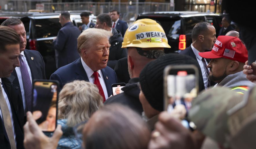 Former President Donald Trump speaks with construction workers at the construction site of the new JPMorgan Chase headquarters in midtown Manhattan, Thursday, April 25, 2024, in New York. Trump met with construction workers and union representatives hours before he&#x27;s set to appear in court. (AP Photo/Yuki Iwamura)