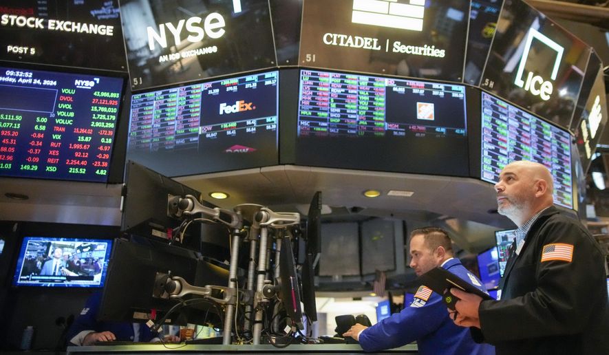 Traders work on the floor of the New York Stock Exchange shortly after the opening bell, Wednesday, April 24, 2024, in New York. (AP Photo/Mary Altaffer)