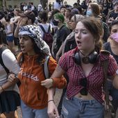 Demonstrators chant at a pro-Palestinian protest at the University of Texas Wednesday April 24, 2024 in Austin, Texas. Protests Wednesday on the campuses of at least two universities involved clashes with police, while another university shut down its campus for the rest of the week. (Mikala Compton/Austin American-Statesman via AP)