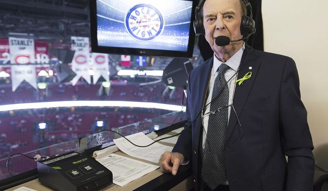 Broadcaster Bob Cole poses prior to calling his last NHL hockey game between the Montreal Canadiens and the Toronto Maple Leafs in Montreal, Saturday, April 6, 2019. Cole, the voice of hockey in Canada for a half-century, has died. He was 90. (Graham Hughes/The Canadian Press via AP, FIle)