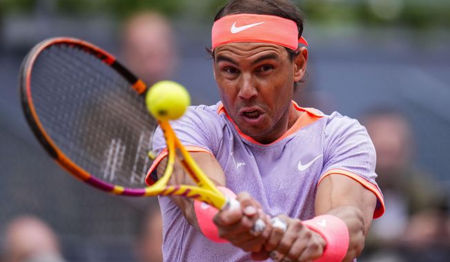 Rafael Nadal of Spain returns the ball to Darwin Blanch of United States during the Mutua Madrid Open tennis tournament in Madrid, Thursday, April 25, 2024. (AP Photo/Manu Fernandez)
